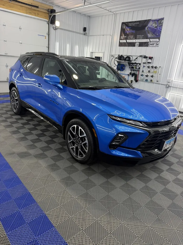 Blue Chevrolet Blazer with fresh ceramic coating in the Porter's Detailing bay